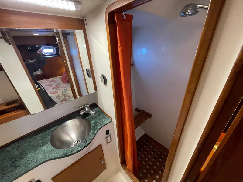 Slide: The Image of Bathroom interior of 2002 Transpacific Marine EAGLE 53 yacht, featuring sink and shower. - 34