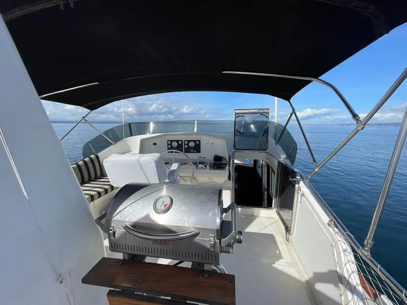 Slide: The Image of Flybridge of 2002 Transpacific Marine EAGLE 53 yacht with grill and seating, ocean view. - 42