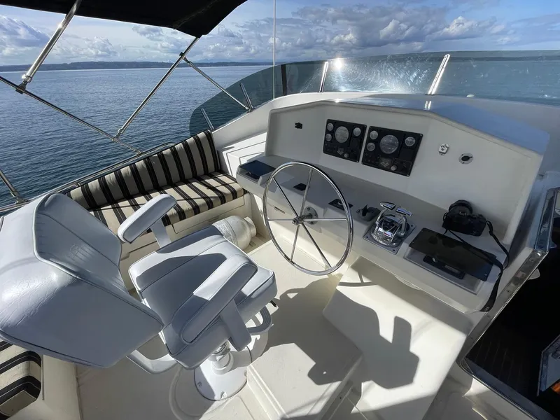 Slide: The Image of Helm of 2002 Transpacific Marine EAGLE 53 yacht with steering wheel and controls. - 43