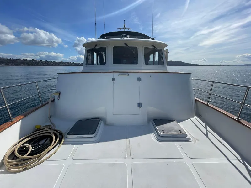 Slide: The Image of Transpacific Marine EAGLE 53 yacht deck, 2002 model, on calm water under blue sky. - 47
