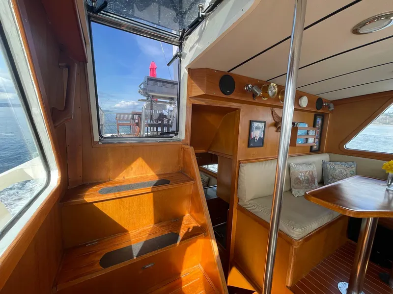 Slide: The Image of Interior of 2002 Transpacific Marine EAGLE 53 yacht with wooden finishes and seating area. - 49