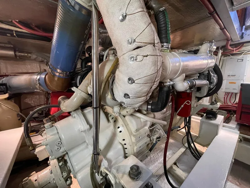 Slide: The Image of Engine room of 2002 Transpacific Marine EAGLE 53 yacht, showcasing complex machinery and components. - 9