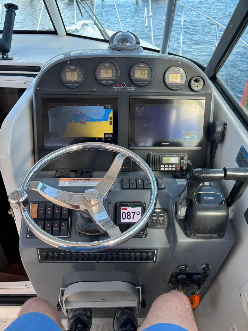 Slide: The Image of Dashboard of a 2006 Pursuit 3370 Offshore boat with navigation instruments. - 5