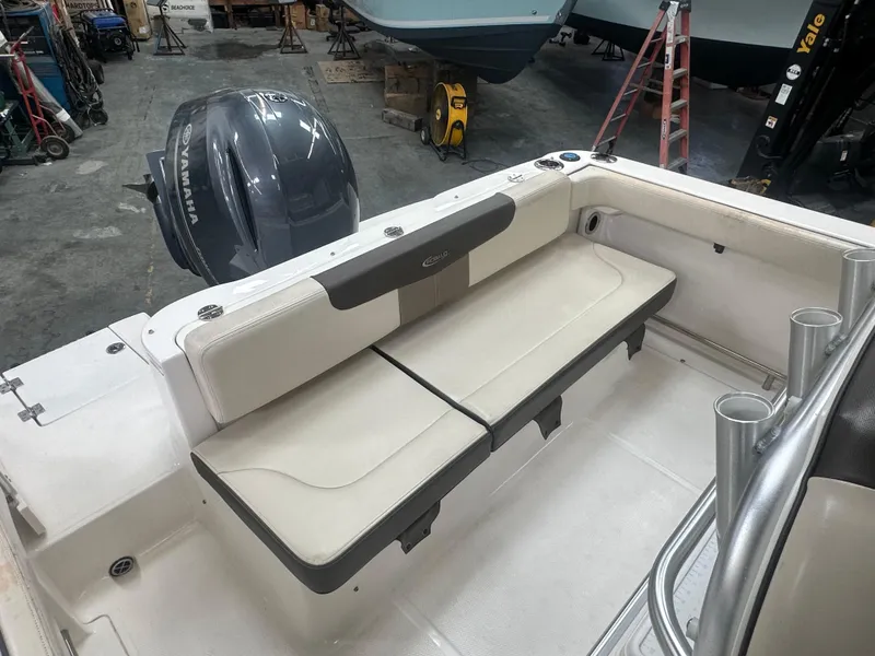 Slide: The Image of 2019 Robalo R222 Center Console boat interior with seating and outboard motor. - 14