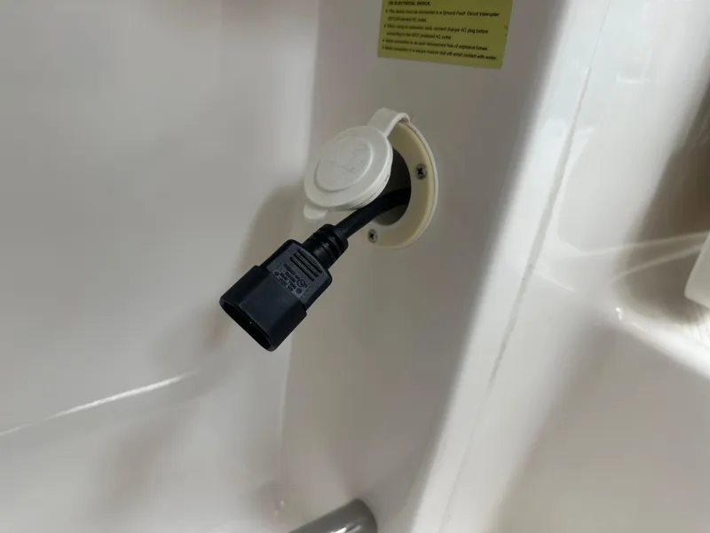 Slide: The Image of Power outlet on 2019 Robalo R222 Center Console boat. - 21