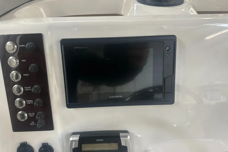 Slide: The Image of 2019 Robalo R222 Center Console dashboard with Garmin display and control panel. - 24