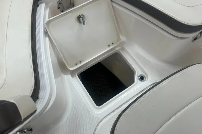 Slide: The Image of 2019 Robalo R222 Center Console boat storage compartment, open hatch view. - 25