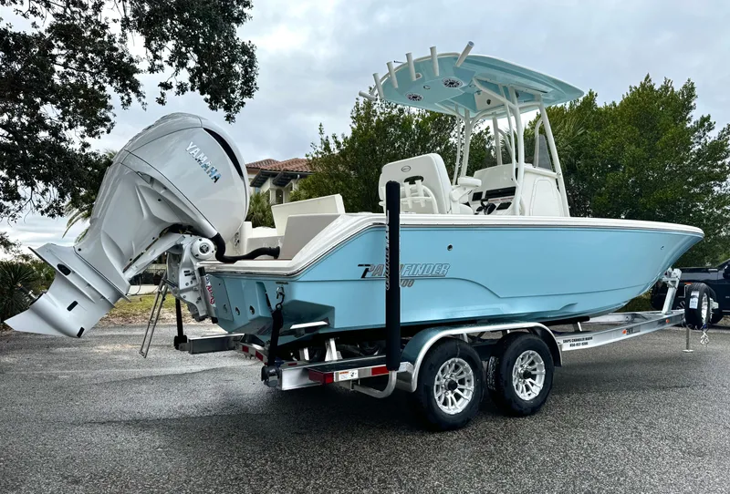 Slide: The Image of 2025 Pathfinder 2400TRS boat on trailer with Yamaha outboard motor, parked outdoors. - 3