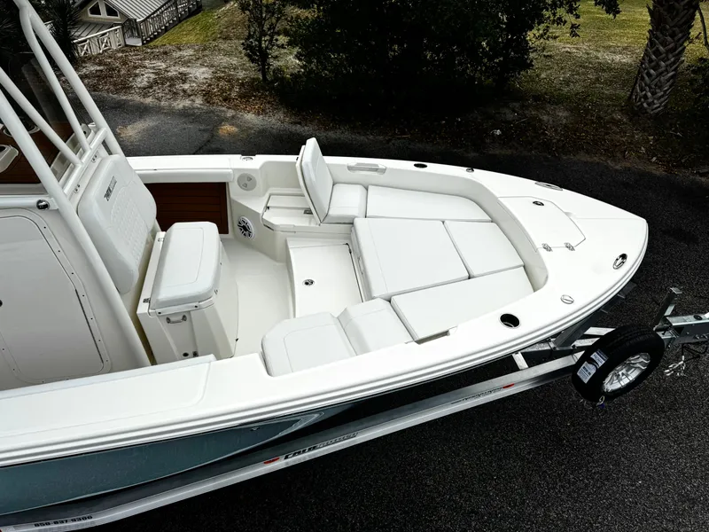 Slide: The Image of 2025 Pathfinder 2400TRS boat with spacious seating and sleek design on a trailer. - 5
