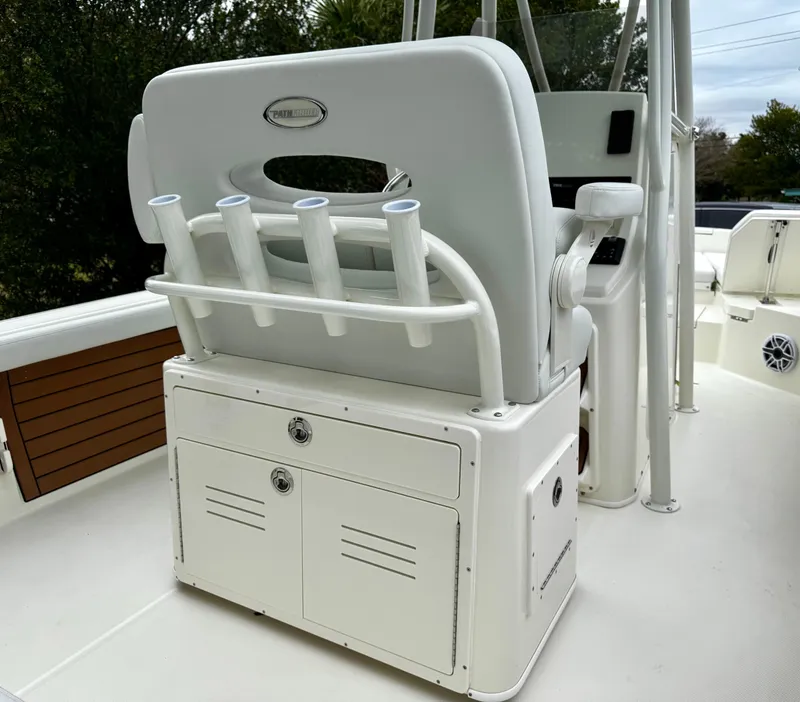 Slide: The Image of 2025 Pathfinder 2400TRS boat interior with rod holders and storage compartments. - 8