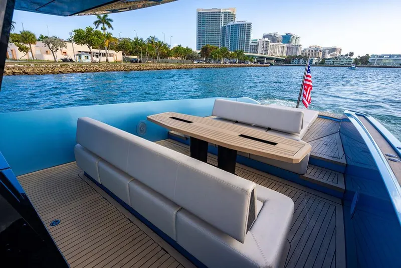 Slide: The Image of Luxury 2022 Wajer 55 S yacht with elegant seating and scenic waterfront view. - 12