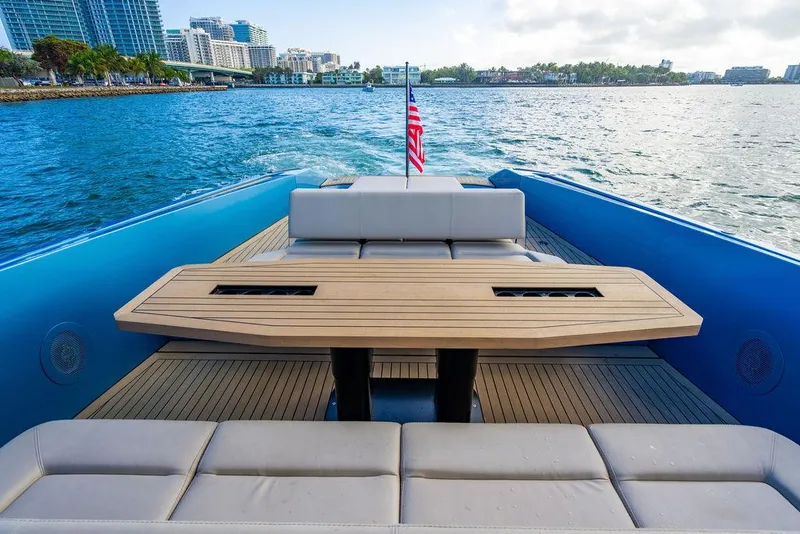Slide: The Image of Luxurious 2022 Wajer 55 S yacht with elegant deck seating and scenic waterfront view. - 13