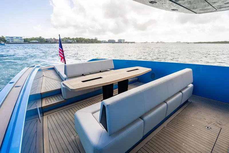 Slide: The Image of 2022 Wajer 55 S yacht deck with seating and table, overlooking calm waters. - 14