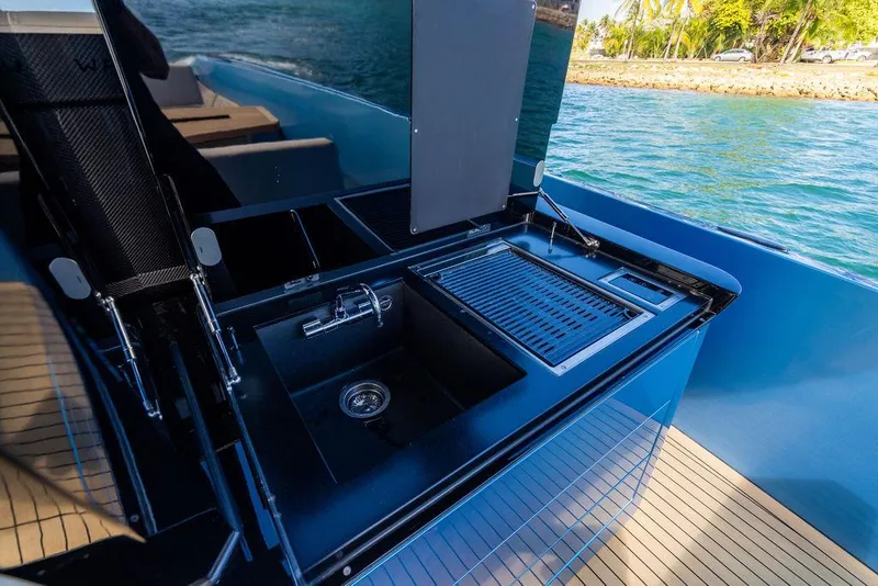 Slide: The Image of Outdoor kitchen on 2022 Wajer 55 S yacht with sink and grill, docked by the water. - 20