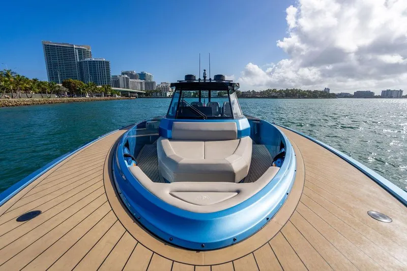 Slide: The Image of 2022 Wajer 55 S yacht on water, city skyline in background, sunny day. - 23