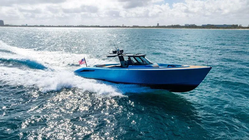 Slide: The Image of 2022 Wajer 55 S yacht cruising on open sea with American flag. - 7