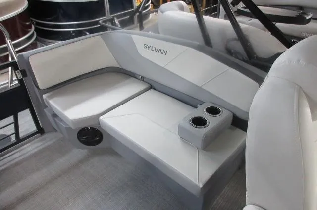 Slide: The Image of 2025 Sylvan A-20 LZ DH boat interior with white seating and cup holders. - 11