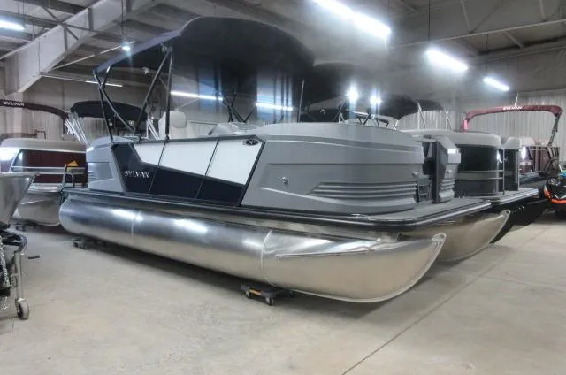 Slide: The Image of 2025 Sylvan A-20 LZ DH pontoon boat in a showroom setting. - 3