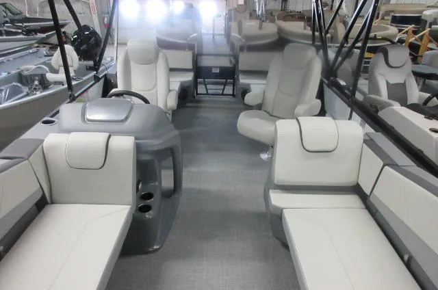 Slide: The Image of 2025 Sylvan A-20 LZ DH boat interior with modern seating and steering console. - 4