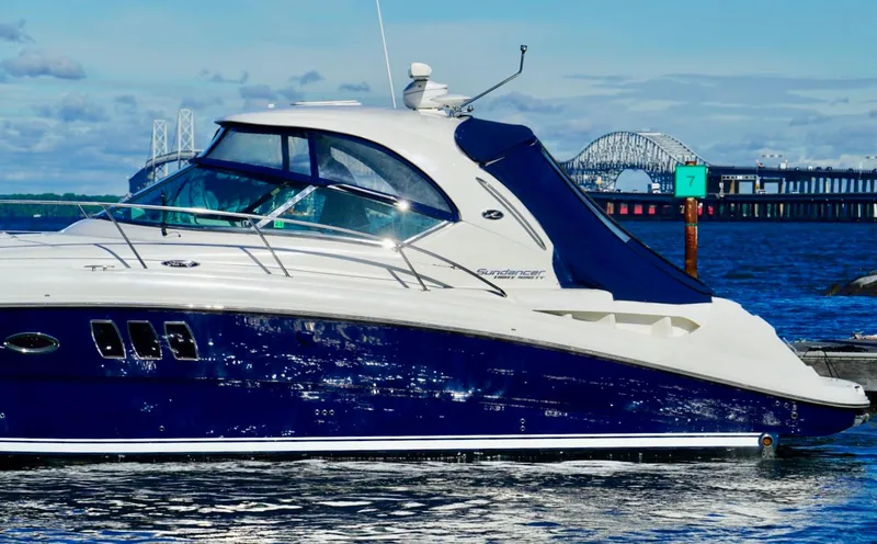 Slide: The Image of Sea Ray 390 Sundancer 2010 yacht on water with bridge in background. - 10