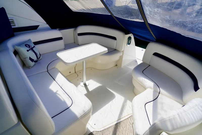 Slide: The Image of Luxurious interior of 2010 Sea Ray 390 Sundancer yacht with white seating and table. - 14