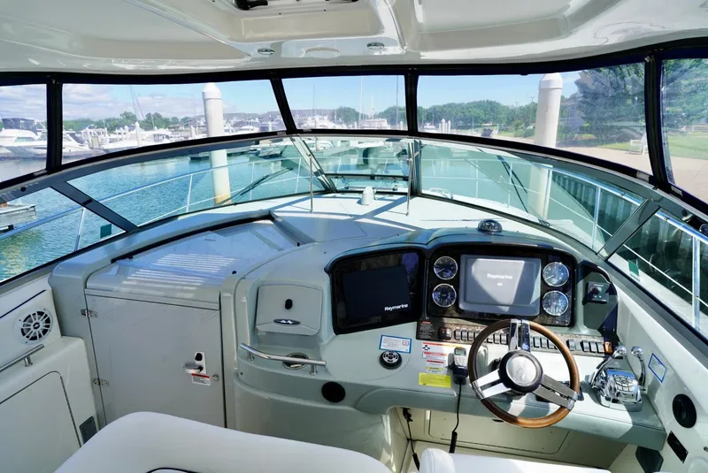 Slide: The Image of Helm of 2010 Sea Ray 390 Sundancer yacht with modern navigation equipment. - 20