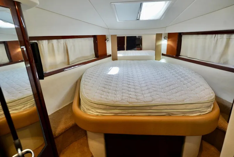 Slide: The Image of Luxurious cabin interior of 2010 Sea Ray 390 Sundancer yacht with cozy bed. - 22