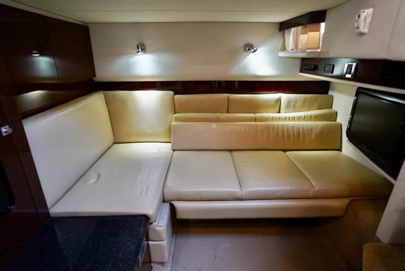 Slide: The Image of Luxurious interior of 2010 Sea Ray 390 Sundancer with beige leather seating. - 27