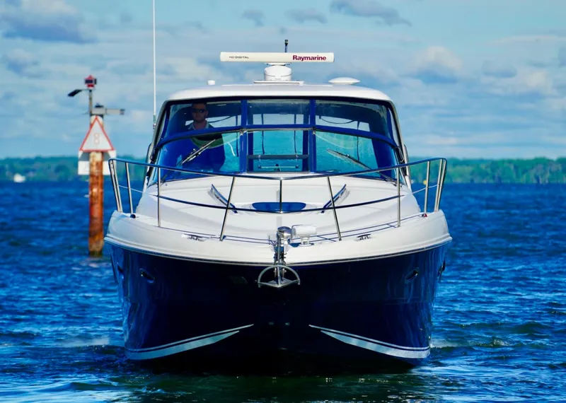 Slide: The Image of 2010 Sea Ray 390 Sundancer cruising on a sunny day, front view. - 3