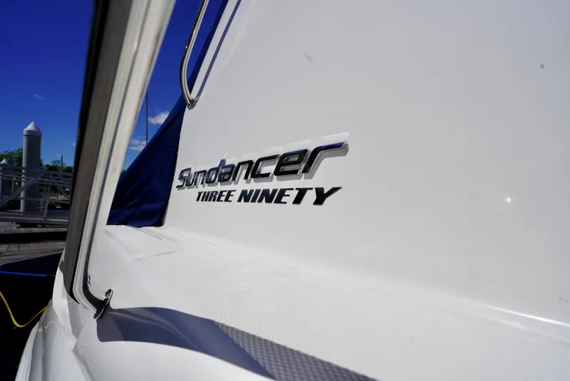 Slide: The Image of Sea Ray 390 Sundancer 2010 boat with logo detail in marina setting. - 40