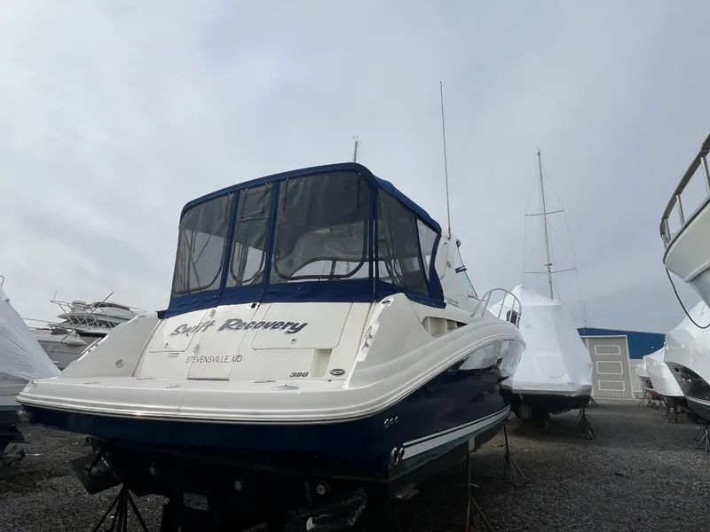 Slide: The Image of 2010 Sea Ray 390 Sundancer yacht on dry dock, rear view with covered cockpit. - 43