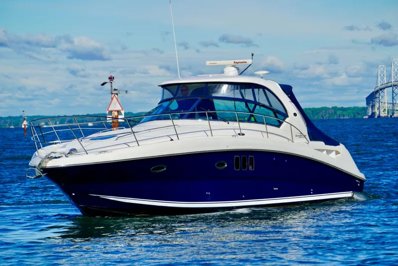 Slide: The Image of 2010 Sea Ray 390 Sundancer yacht cruising on open water. - 6