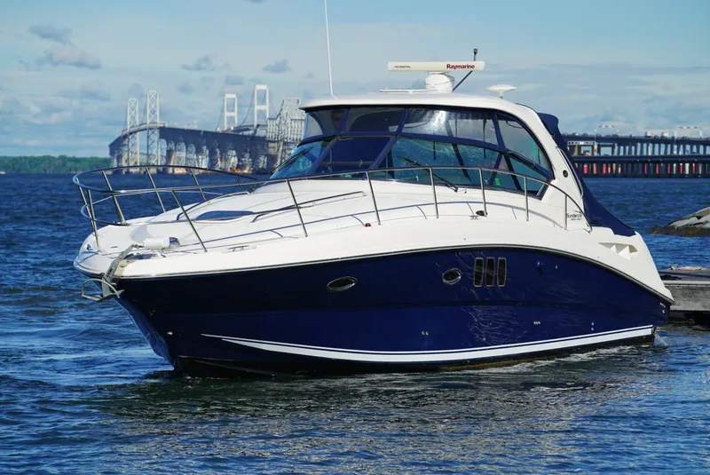 Slide: The Image of Sea Ray 390 Sundancer 2010 yacht on water with bridge in background. - 8