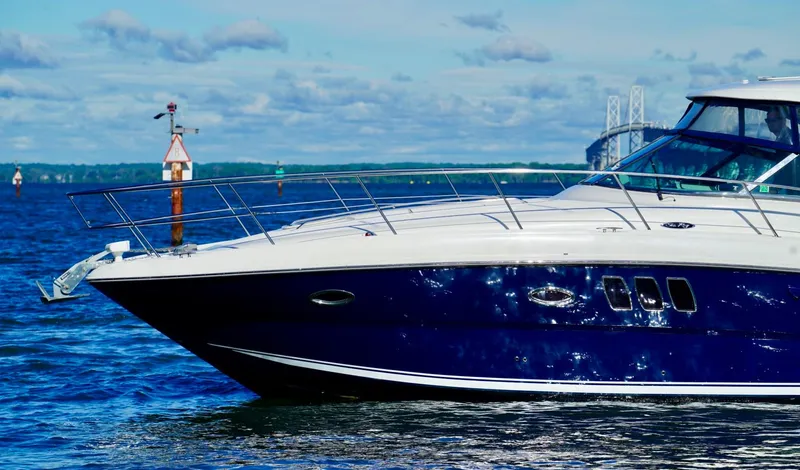 Slide: The Image of Sea Ray 390 Sundancer 2010 yacht cruising on a sunny day with scenic water backdrop. - 9