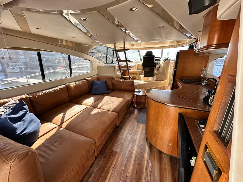 Slide: The Image of Luxurious interior of a 1999 Cruisers 5000 Sedan Sport yacht with leather seating and modern amenities. - 3