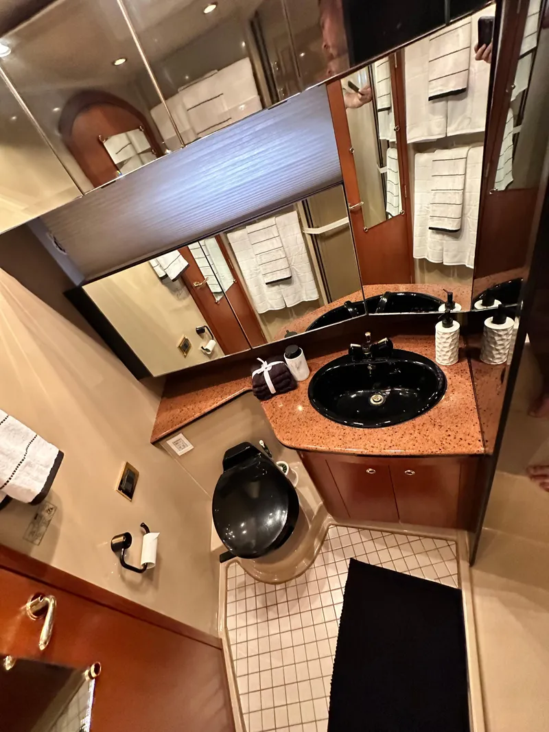 Slide: The Image of Luxurious bathroom in 1999 Cruisers 5000 Sedan Sport yacht with modern fixtures. - 12
