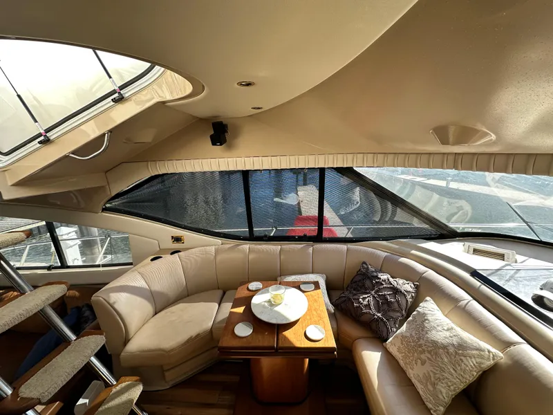 Slide: The Image of Luxurious interior of 1999 Cruisers 5000 Sedan Sport yacht with plush seating and elegant decor. - 6