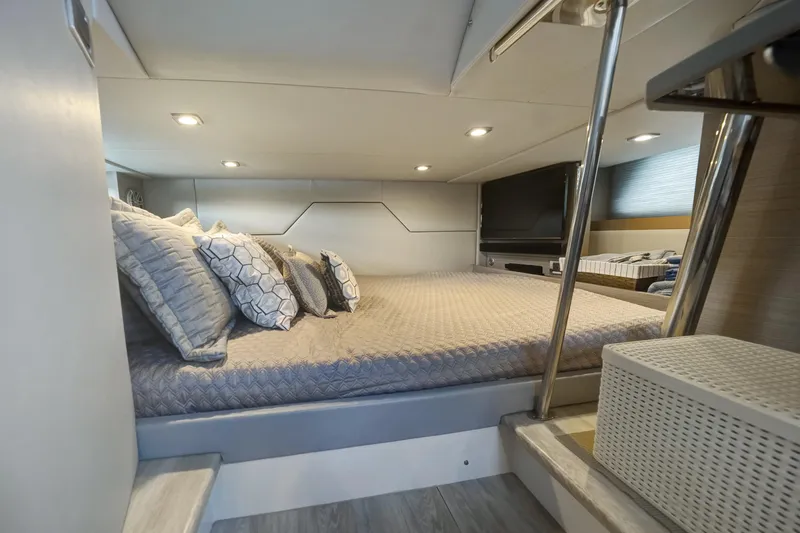 Slide: The Image of 2018 Formula 430 Super Sport Crossover cabin with cozy bed and modern decor. - 15