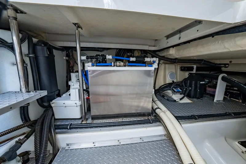 Slide: The Image of Engine compartment of 2018 Formula 430 Super Sport Crossover boat, showcasing mechanical components. - 19