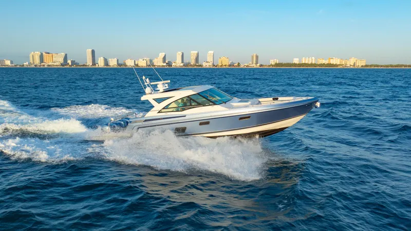 Slide: The Image of 2018 Formula 430 Super Sport Crossover cruising on ocean with city skyline in background. - 32