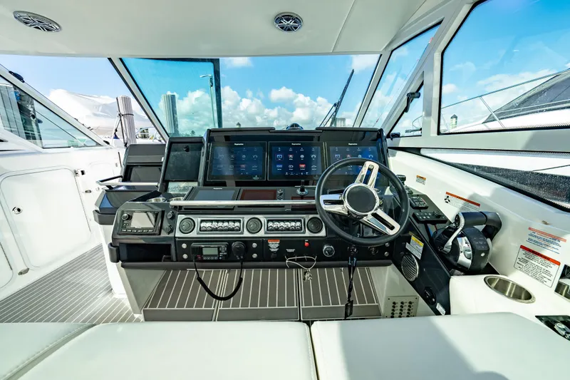 Slide: The Image of 2018 Formula 430 Super Sport Crossover helm with modern navigation controls and panoramic view. - 9