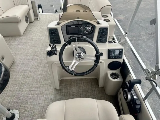Slide: The Image of 2019 Qwest 818 boat interior with steering wheel and control panel. - 13