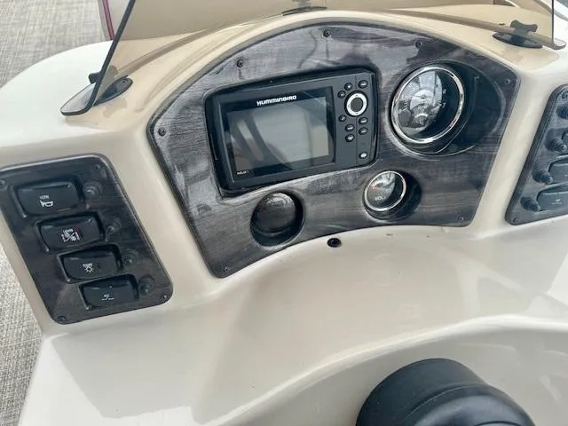 Slide: The Image of Control panel of 2019 Qwest 818 boat with navigation system and gauges. - 14