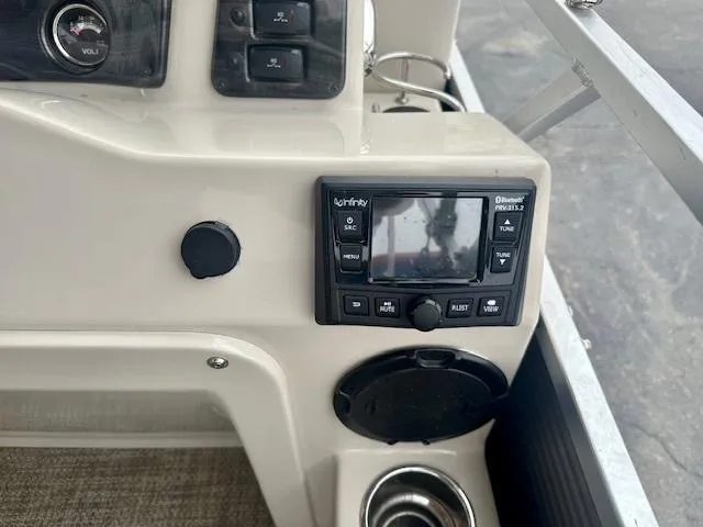 Slide: The Image of Control panel of a 2019 Qwest 818 boat featuring a Bluetooth stereo system. - 15