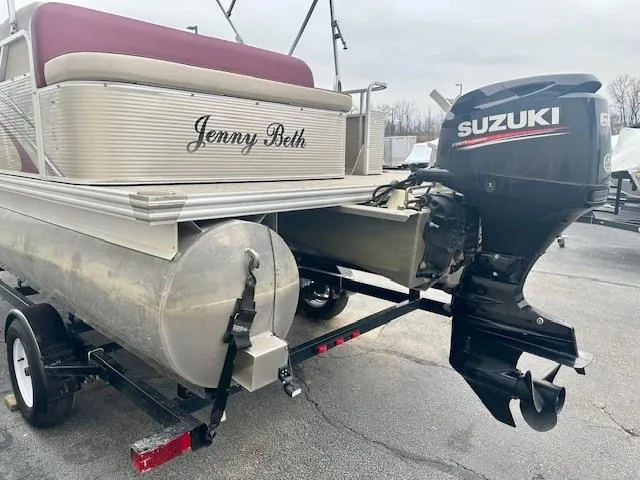 Slide: The Image of 2019 Qwest 818 pontoon boat with Suzuki outboard motor on trailer. - 4