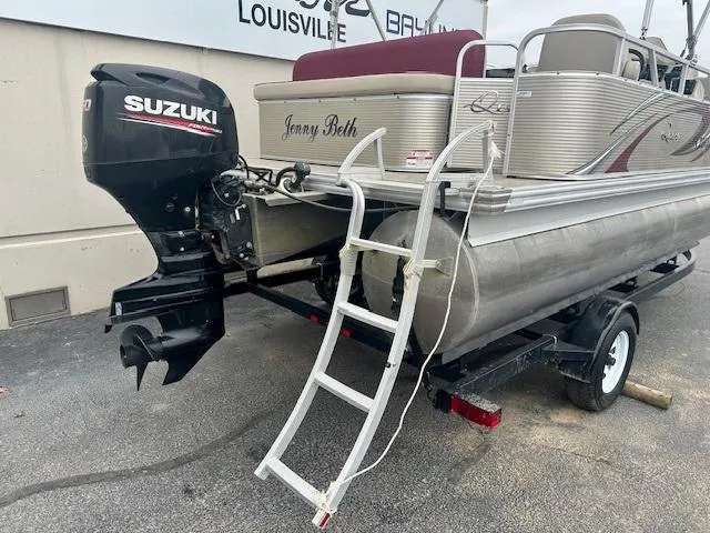 Slide: The Image of 2019 Qwest 818 pontoon boat with Suzuki outboard motor and ladder on trailer. - 5