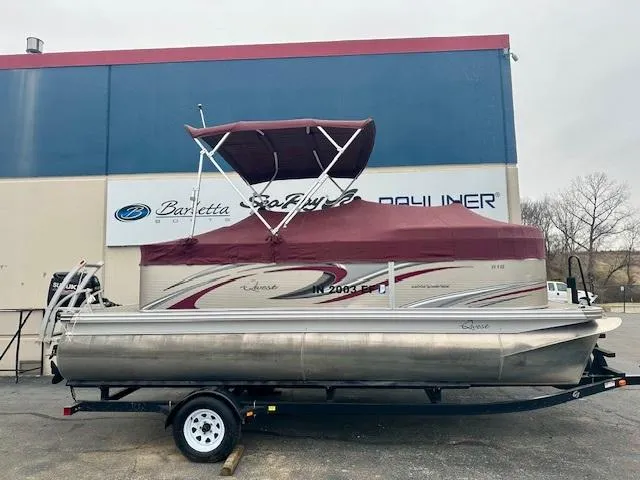 Slide: The Image of 2019 Qwest 818 pontoon boat with maroon canopy on a trailer. - 6