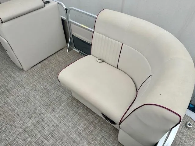 Slide: The Image of 2019 Qwest 818 boat interior with beige seating and carpeted flooring. - 9
