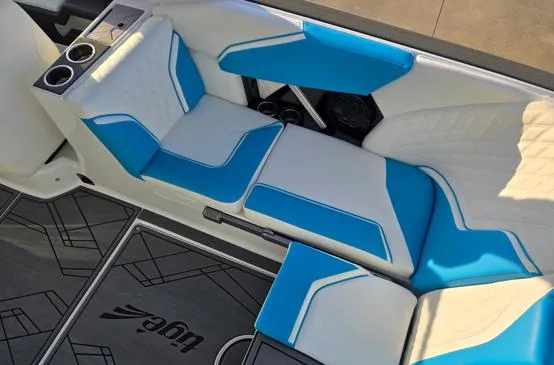 Slide: The Image of Interior of 2025 Tigé 24RZX boat with blue and white seating. - 10