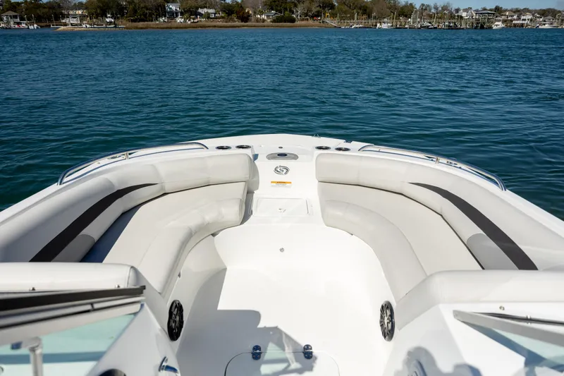 Slide: The Image of 2023 Hurricane SunDeck 187 OB boat interior with spacious seating on calm water. - 10